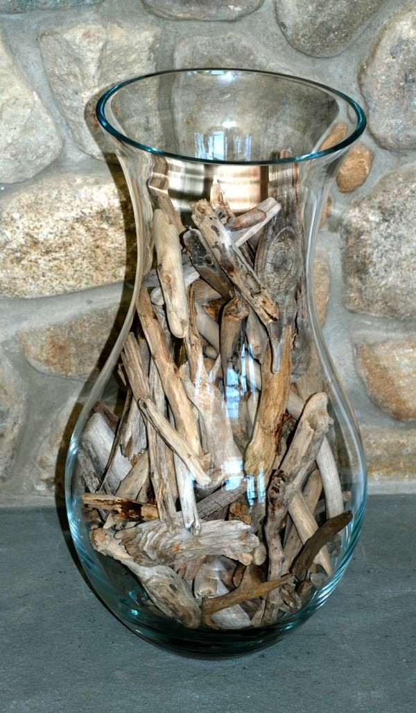 jarrón cristal relleno madera flotante 