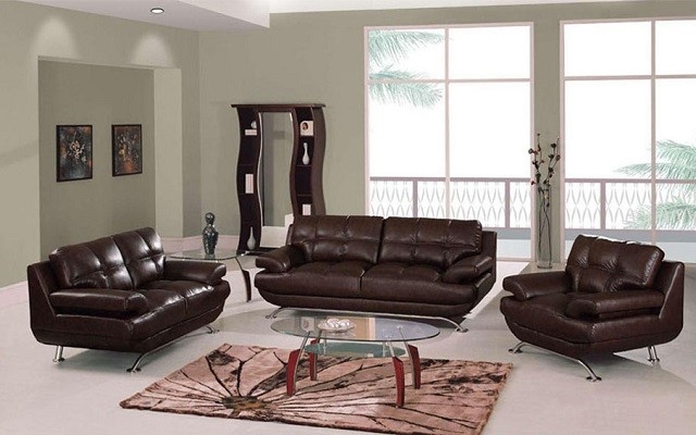 salon moderno muebles cuero marron pared verde claro 