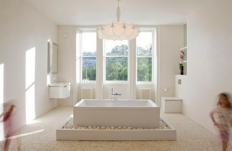 bañera blanca rectangular piedras zen