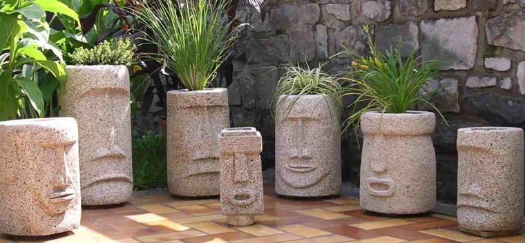 decoración con maceteros creativos caras esculturas