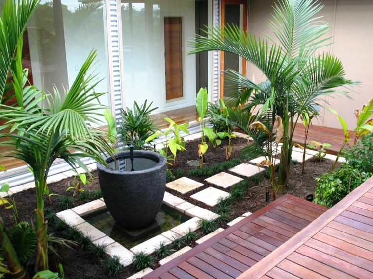 jardín con suelo de madera y fuente decorativa jardin estilo contemporaneo suelo madera fuente decorativa