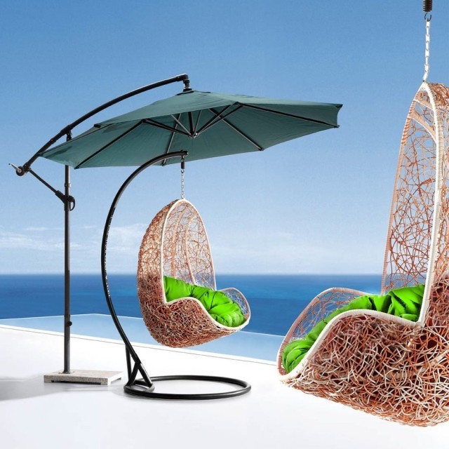 sillones colgantes con cojines verdes silla colgante parasol verde cojines