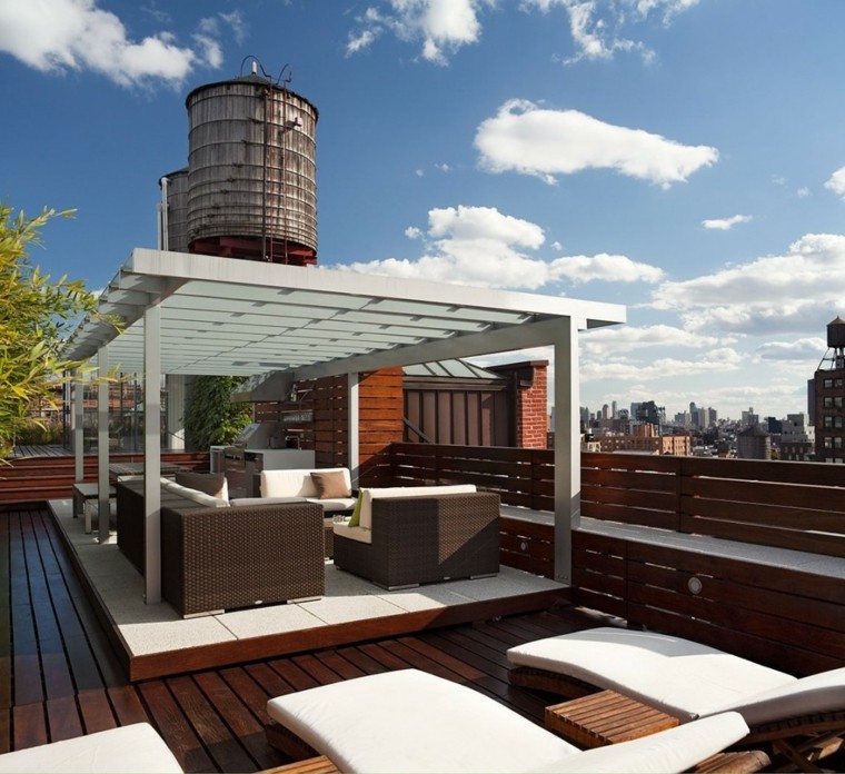 espacio con pérgola terraza asientos cojines plantas pergolas