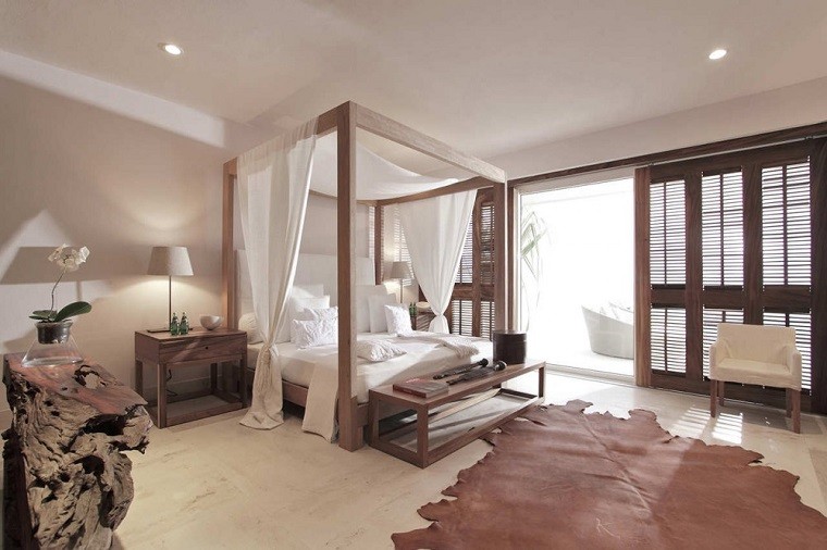 cama dosel madera alfombra cuero dormitorio romantico ideas