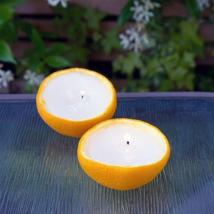 mesa velas jardines flores naranjas