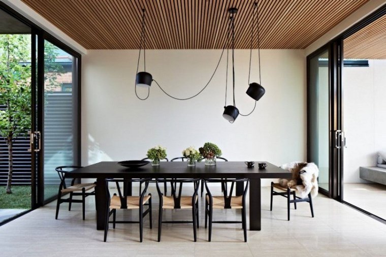 azulejo travertino suelo pared casa moderna mesa negra comedor ideas