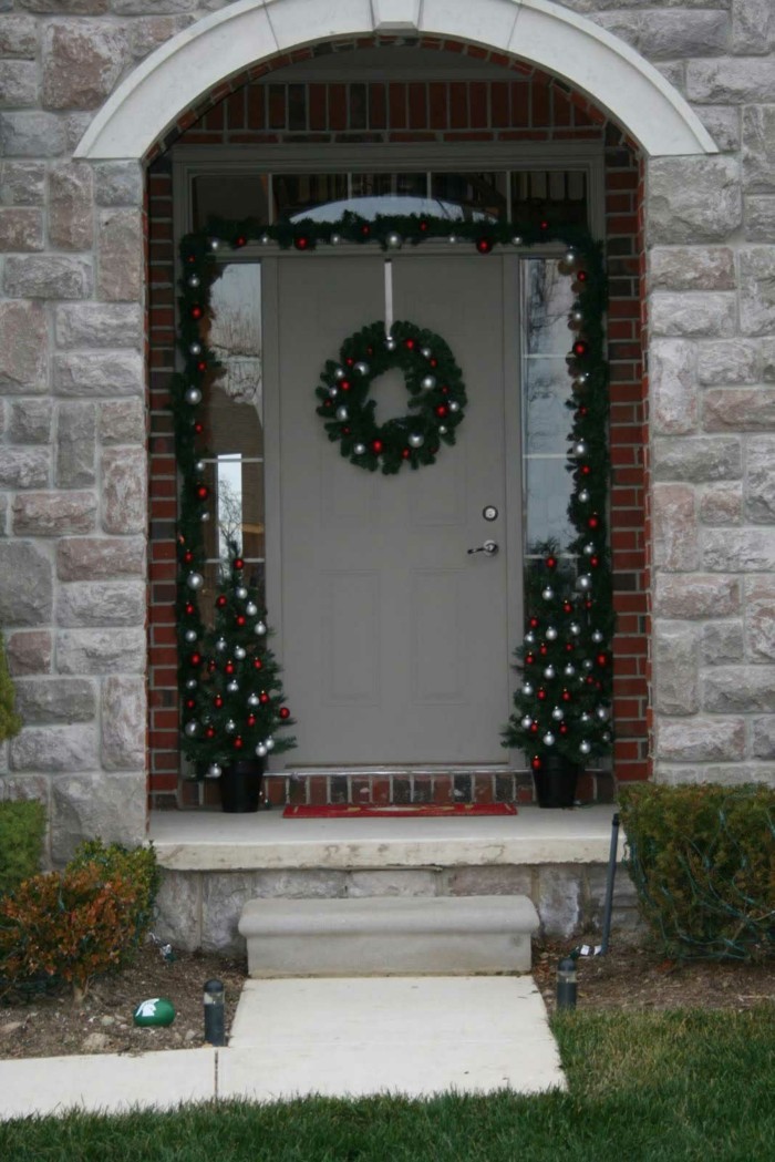 Entrance decorated with Christmas garlands