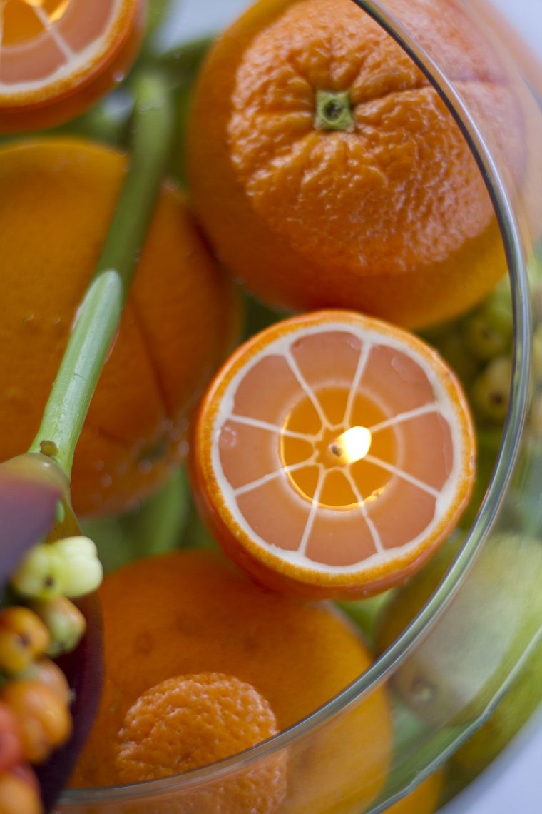 centros mesa velas naranja frutas