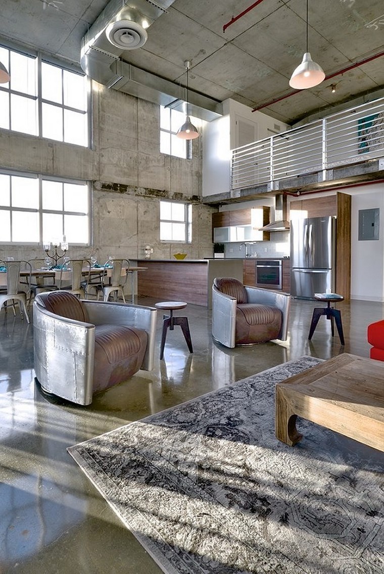 loft industrial con paredes de hormigón hormigon armado sillones salon industrial ideas