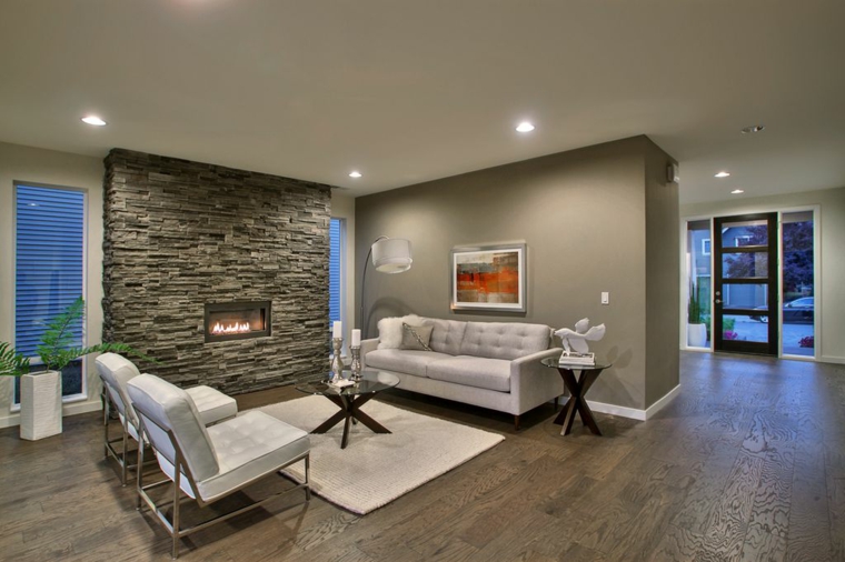 Living room with gray stone wall