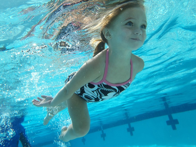 Girl swimming underwater
